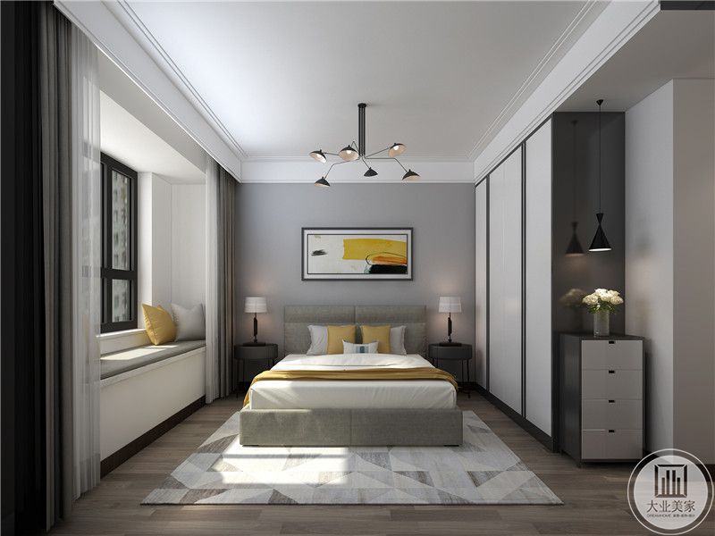 卧室是浅灰色系的设计，床头裴景强是现代艺术画