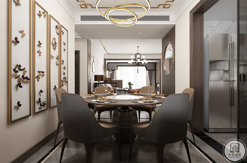圆形吊灯和圆形餐桌的搭配让新中式得元素展现的淋淋尽致。